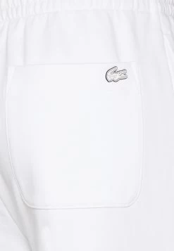 Lacoste Tracksuit Bottoms - White -Ladies Clothing Shop bd6a5a0e54994cffae5a4ec3c6bde555